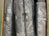 a box full of rolls of plastic wrap on the ground