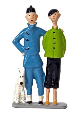 two figurines of a man and a woman with a dog