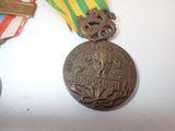 two medals sitting on a table next to each other