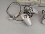 two video game controllers sitting next to each other on a table