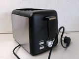 an image of a toaster that is plugged into the wall