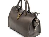 a brown handbag on a white background