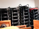 many chairs and tables in a room with a lot of them
