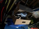 a cardboard box with a pair of shoes inside of it
