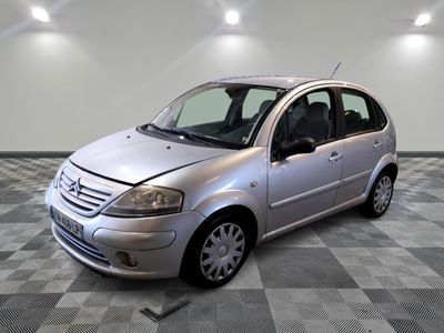 a picture of a silver car parked in a garage