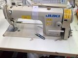 a sewing machine that is sitting on a table