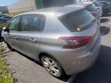 a silver car that is parked in a parking lot