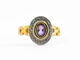 une bague en or jaune sertie d'une amethoralite ovale et de diamants