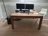 a desk with two monitors and a laptop on it