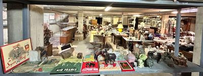 many different types of toy animals on display in a store