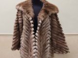 a woman ' s fur coat on a mannequin mannequin mannequin mannequin mannequin mannequin mannequin mannequin