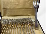 silverware in a case with forks and spoons in it