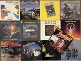 a lot of different album covers on the wall
