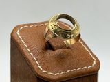 a ring that is sitting on top of a wooden box