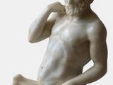 a statue of a man sitting on top of a horse