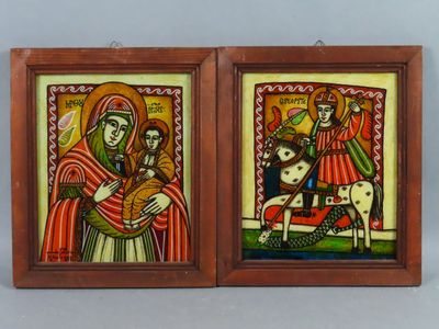 deux tableaux encadrés représentant une femme et un homme avec une chèvre