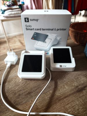 a white box with a picture of a cell phone and a charger
