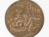 an image of a bronze medal depicting a man and a woman