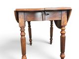 an old wooden table with a drawer on top of it
