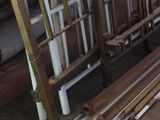 several pieces of wood are stacked on top of each other in a room