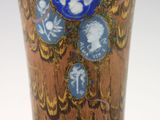 a close up of a vase with a picture of a woman on it