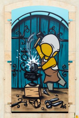 painting of a man with a hammer in front of a blue door