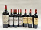 six bottles of red wine are lined up in a row