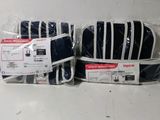 several pieces of luggage are wrapped in plastic and ready to be shipped