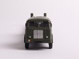 a toy truck that is sitting on a white surface