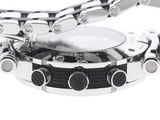 a close up of a watch with a chain around it