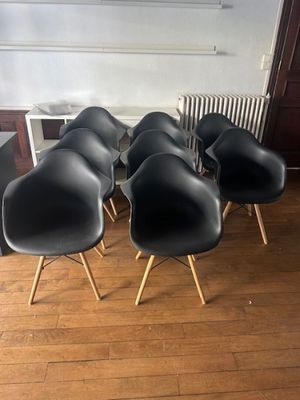 six black eames chairs with wooden legs and a radiator radiator radiator radiator radiator radiator radiator ra