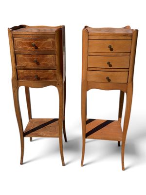 pair of wooden bedside tables with drawers and a shelf on each side