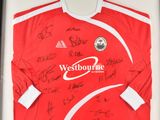 a framed picture of a red shirt with the words westbourne written on it