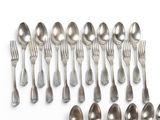 a lot of spoons and spoon spoons on a white surface
