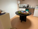 a table with a bag of food on it in the kitchen