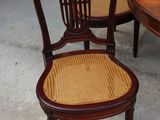two chairs and a table in a room