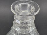 a clear glass vase that is sitting on a table