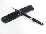 a pen that is laying on top of a pen case