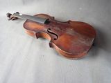 a violin that is laying on the floor