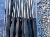 a bunch of tools in a plastic container on the ground