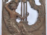 an image of a sculpture of a woman playing a harp