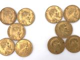 a group of five gold sovereigns and two sovereign sovereigns