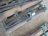 several pieces of metal are sitting on top of a wooden pallet