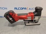 a corded jig saw is sitting on top of a table