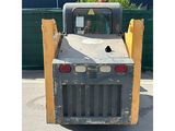 an image of a small construction vehicle parked in a parking lot