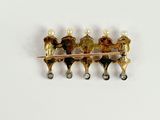 a picture of a brooch with pearls on it