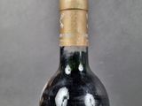 a bottle of wine that is sitting on a table