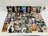 a lot of old movie posters on a white table