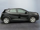a black car that is parked on a gray floor