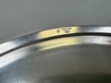 a close up of a metal pan with a lid